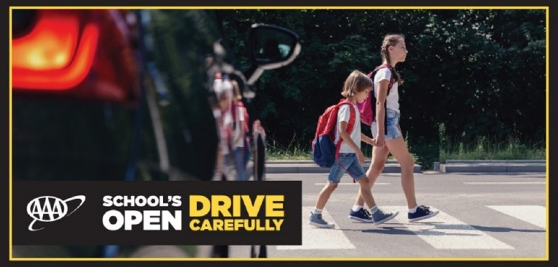 young students travel along a cross walk