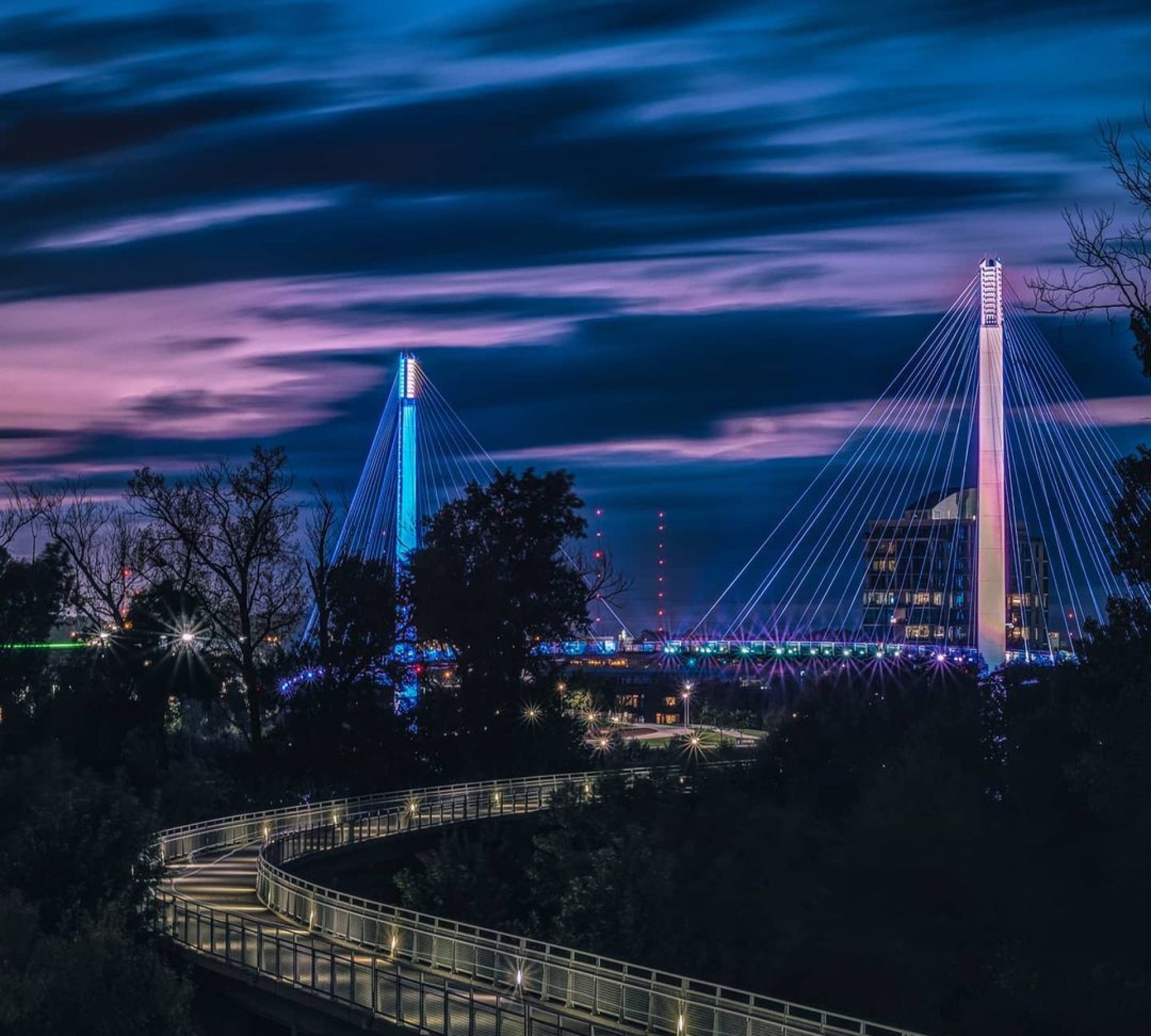 Beautiful colors line the sky with the Bob Kerrey Pedestrian Bridge at dusk