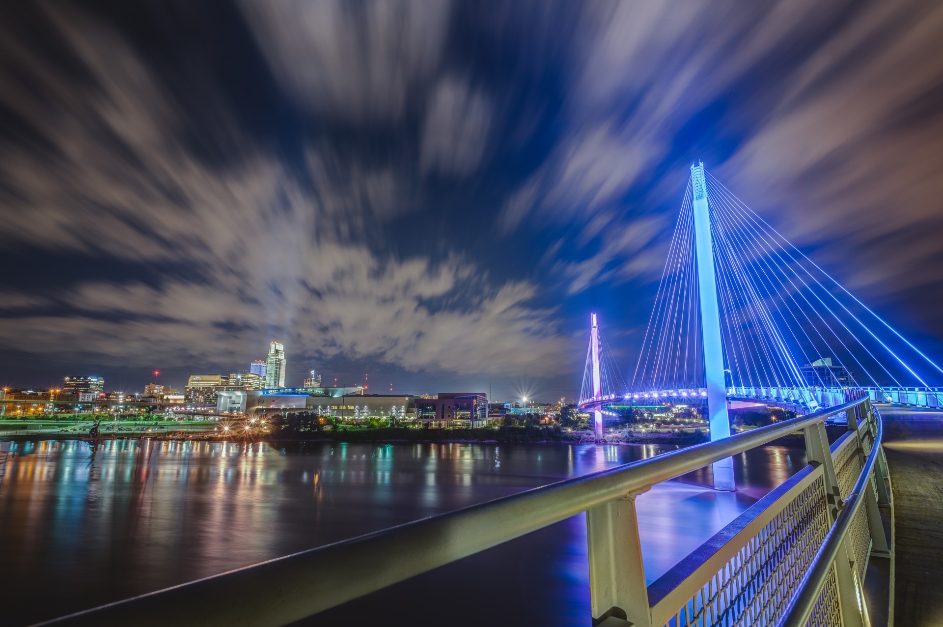 Bob Kerrey Pedestrian Bridge lights up with color across the Missouri River at night