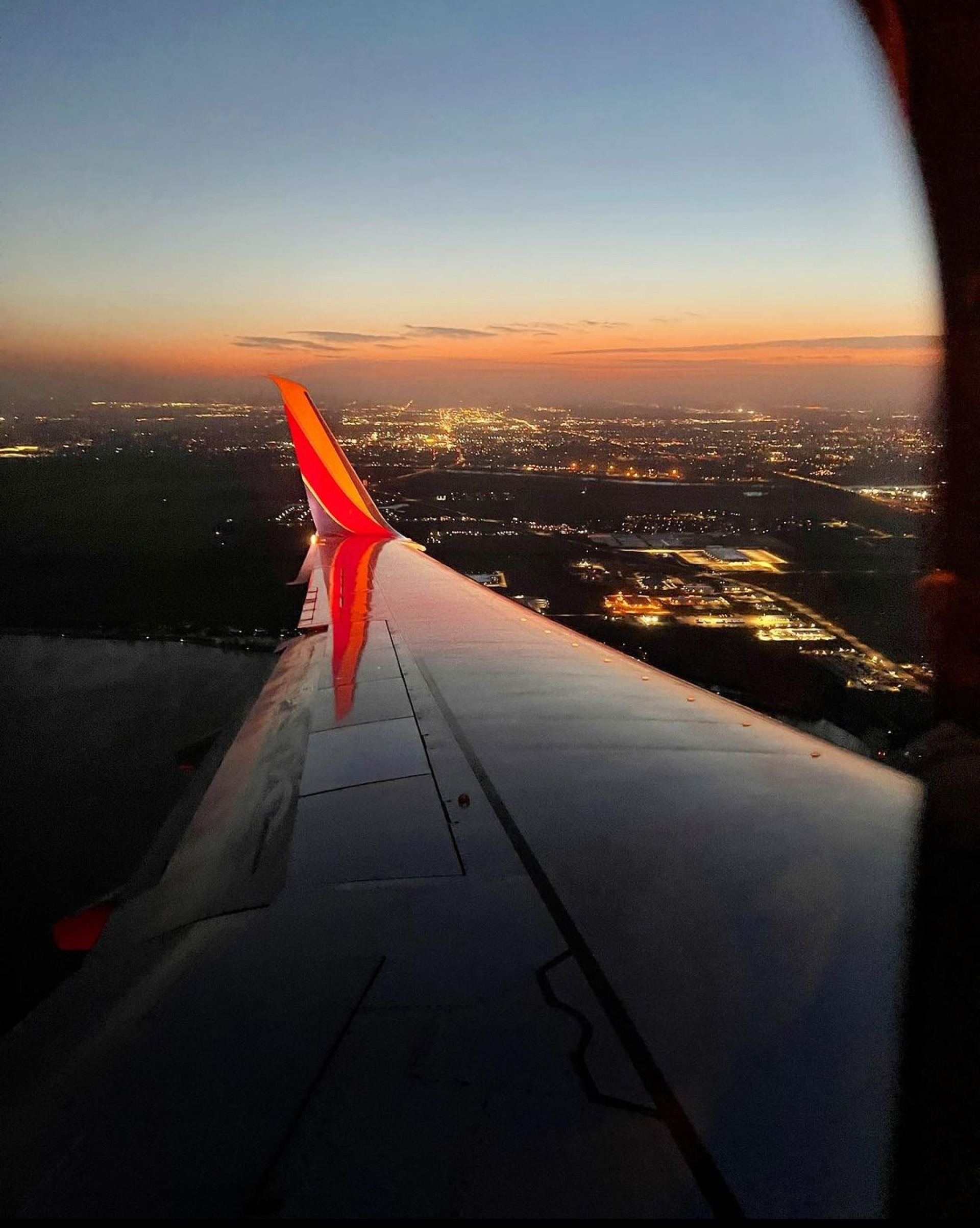 An airplane wing overlooks Omaha Eppley Airfield