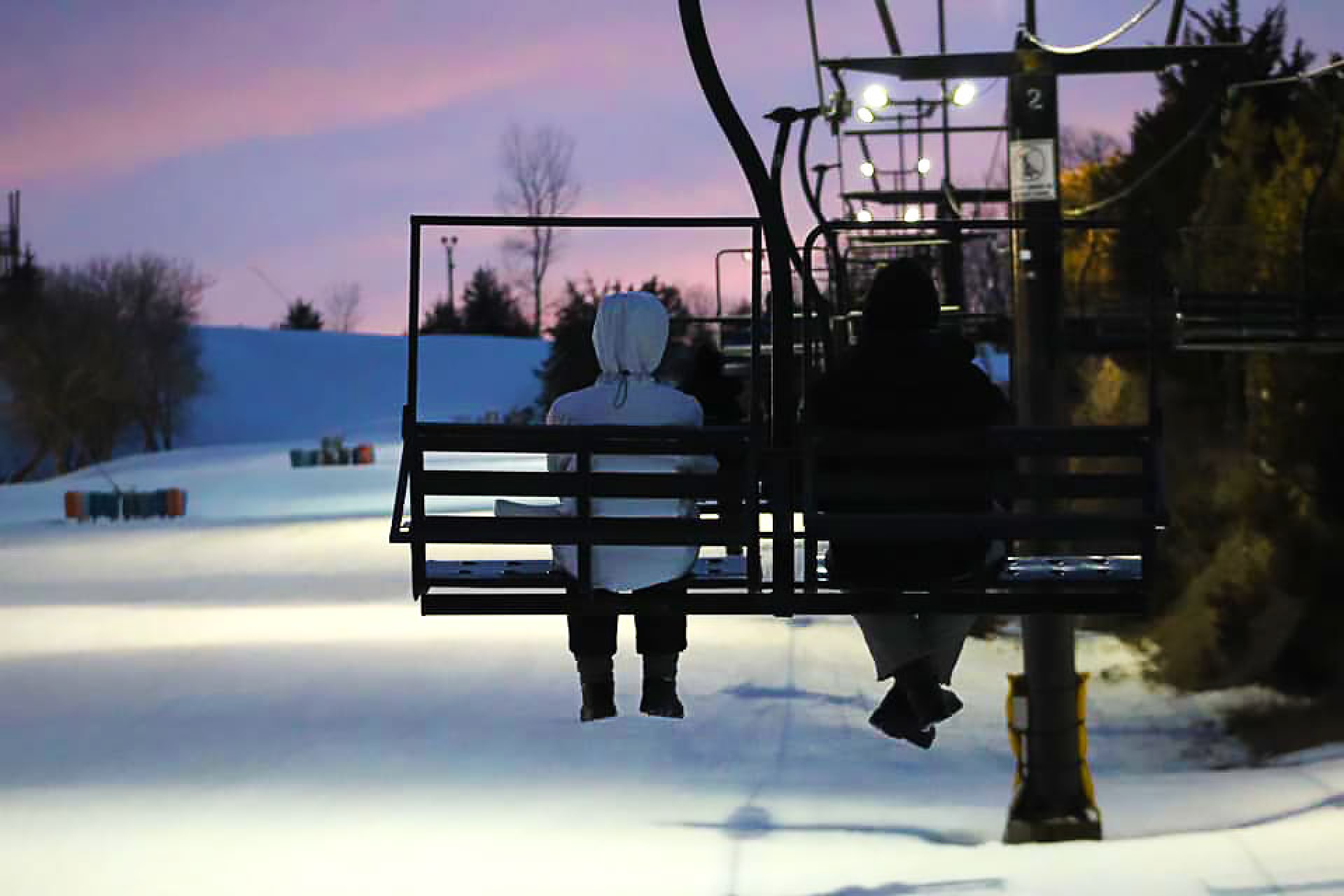 two people on a ski lift at crescent hill