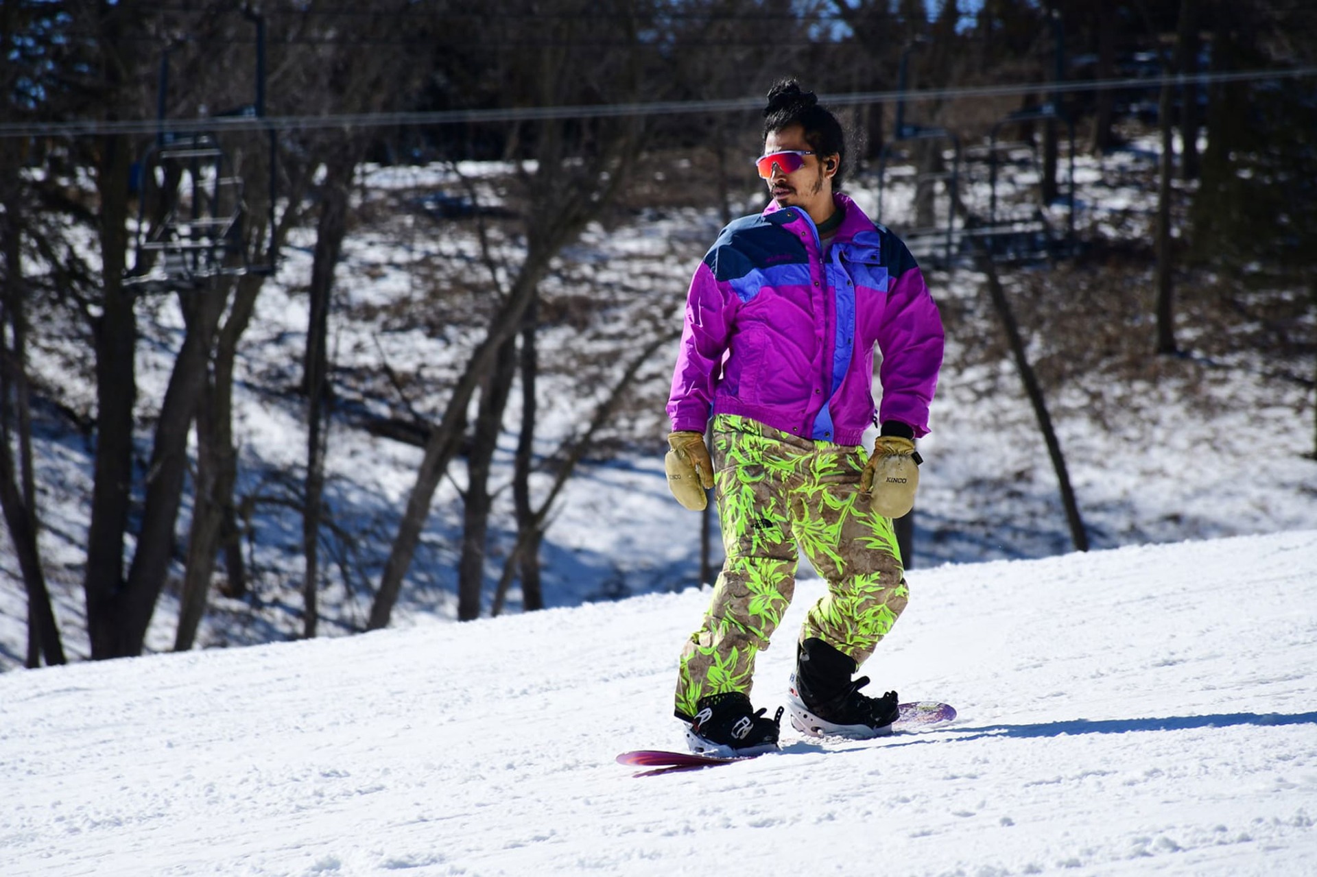 Snowboarder glides down slopes at Crescent Hill at Hitchcock