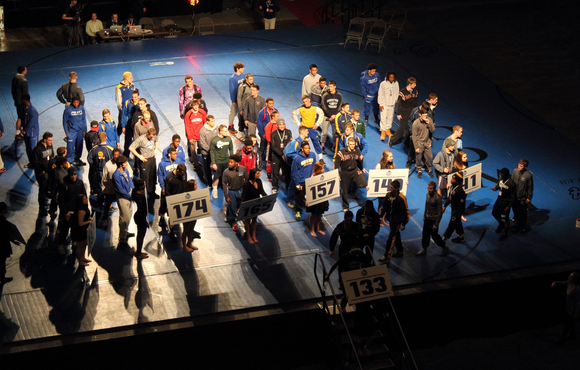 Finalists of each weight class line the mat at the NJCAA National Wrestling  Tournament