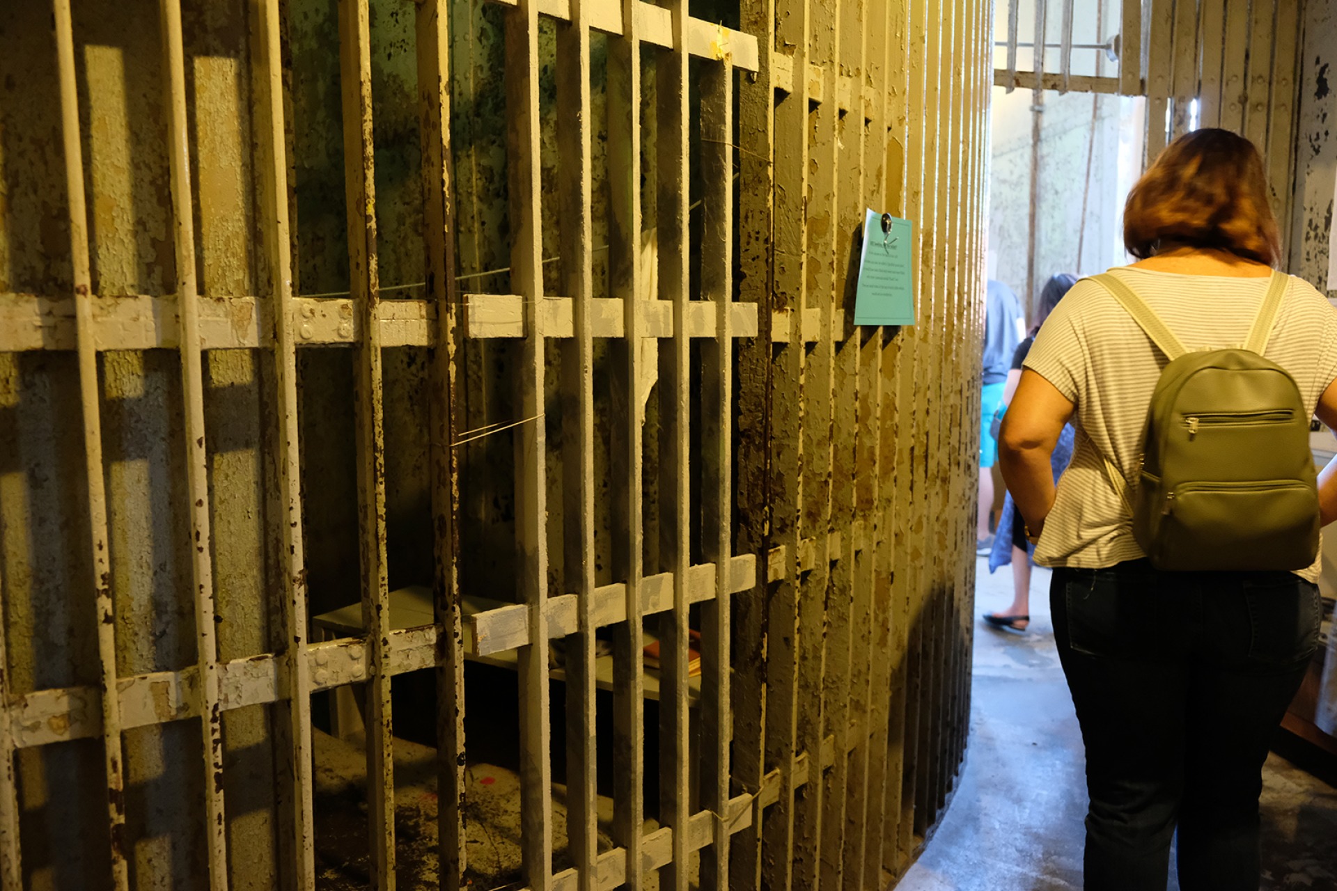 Visitors tour the inside of the Historic Squirrel Cage Jail