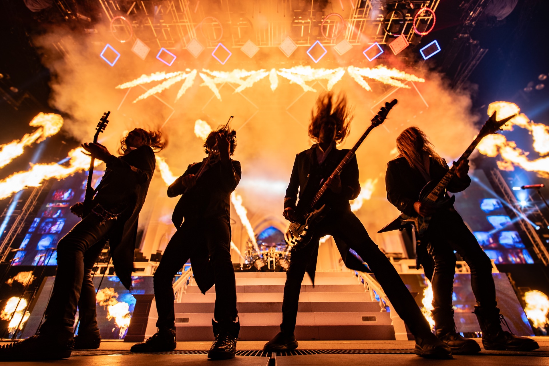 Artists of TSO perform in front of pyro