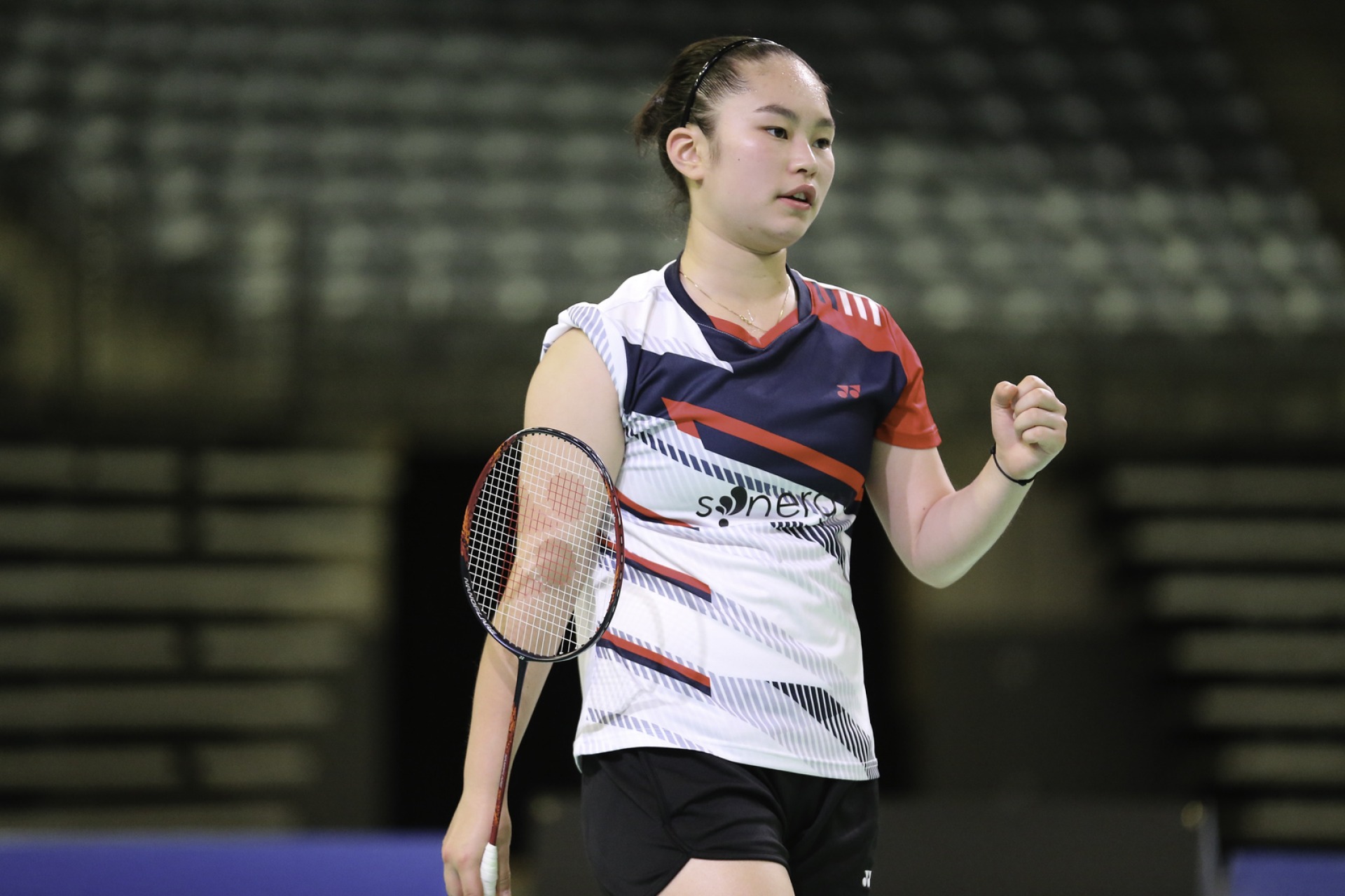 a badminton player celebrates at the 2023 US Open in Council Bluffs