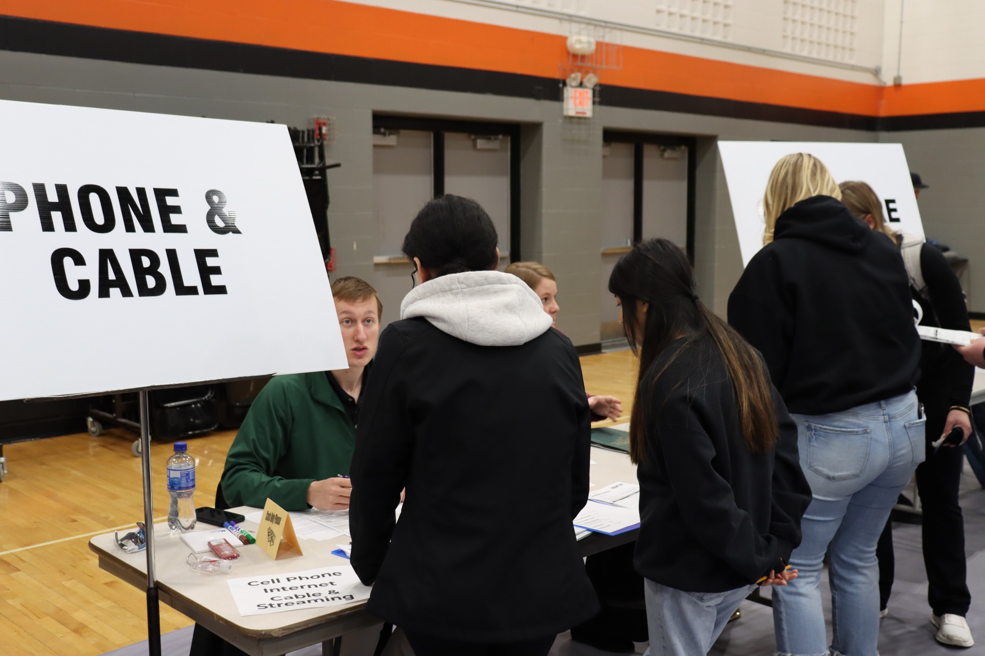 Students at the Phone and Cable table at the Reality 101 fair.
